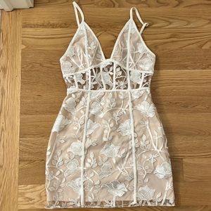 Sheer white mini dress with lace details